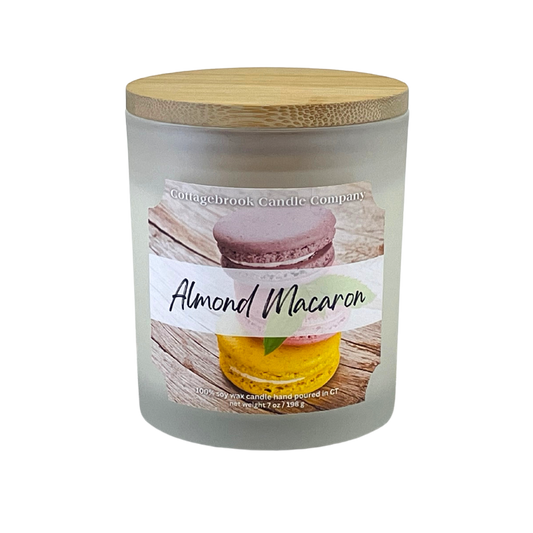 100% Soy Wax Candle with 'Almond Macaron' label on frosted glass container with bamboo lid