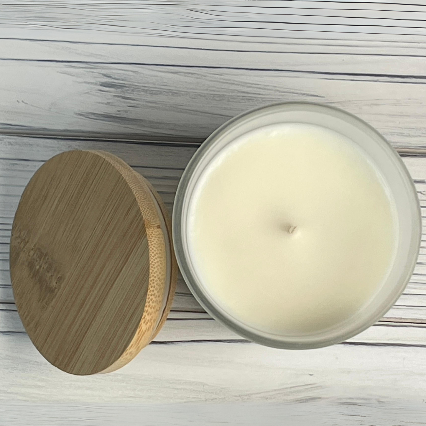 Top view of 7 oz. Almond Macaron 100% Soy Wax candle in frosted glass jar with bamboo lid